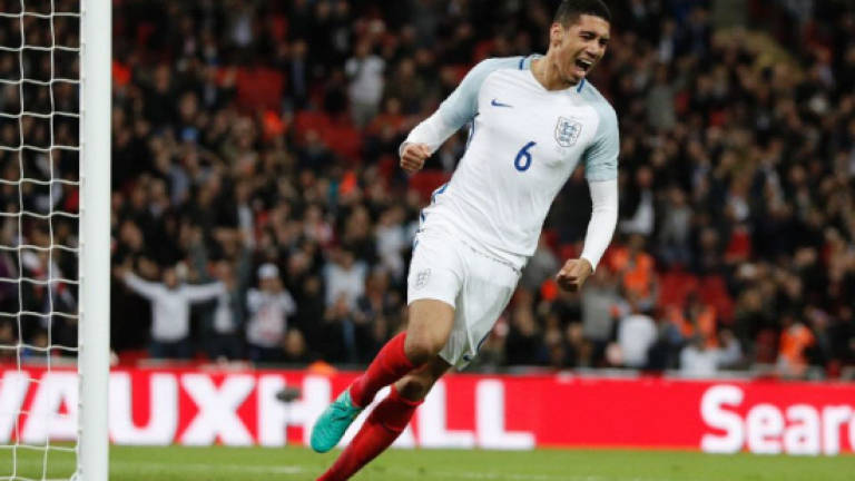 Smalling saves England against 10-man Portugal
