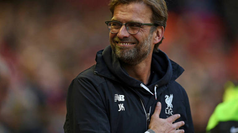 Liverpool look to ramp up top four bid
