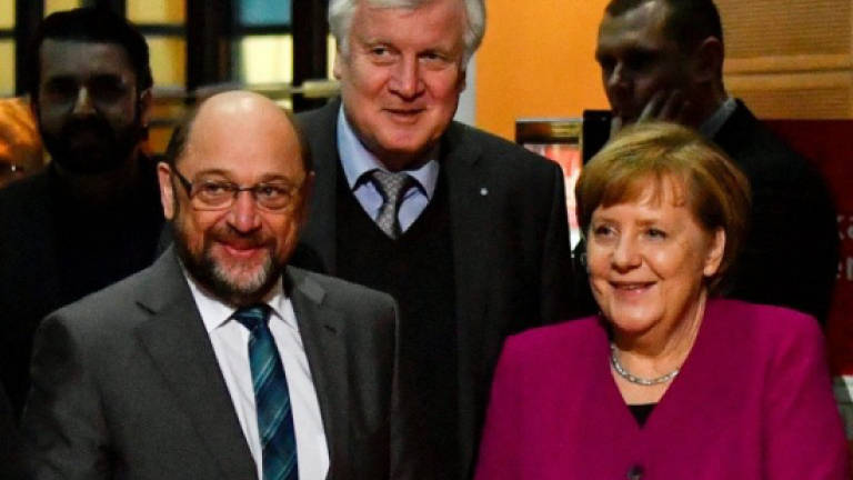 'Decisive' talks for new Merkel govt begin
