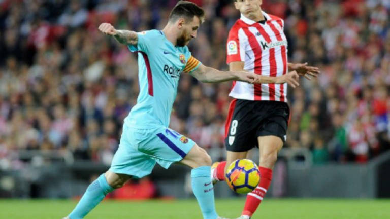 Messi maintains under-par Barca's lead over resurgent Valencia