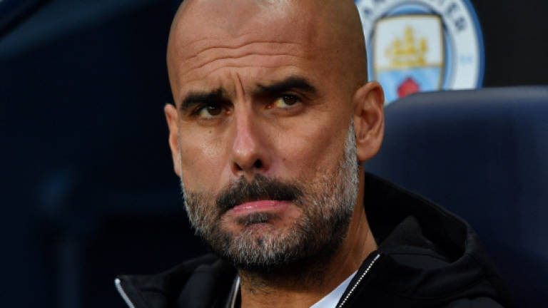 Fuming Guardiola blames referees for City's Euro exit