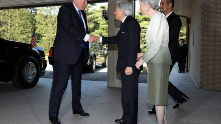 Trump passes tricky protocol test with Japanese emperor
