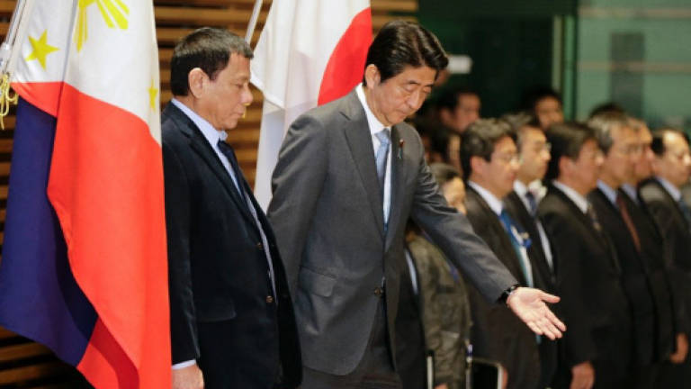 Japan's Abe queries Duterte on anti-US stance