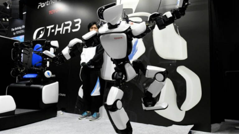 Toyota showcases humanoid robot that mirrors user