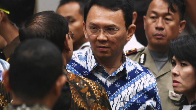 Jakarta's former governor to drop appeal against jail term