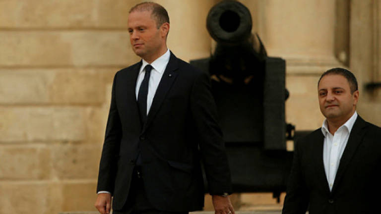 Malta PM says slain blogger was his 'biggest adversary' but vows justice