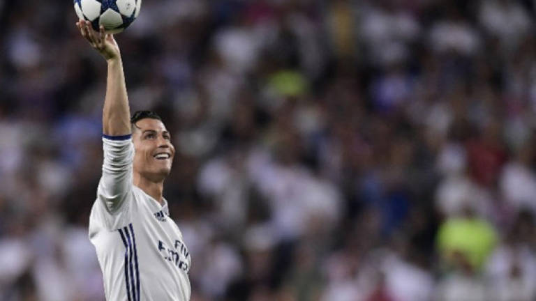 Hat-trick hero Ronaldo first to 100 Champions League goals