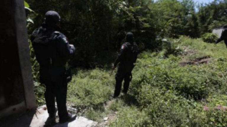 32 bodies, 9 human heads found in Mexico mass graves