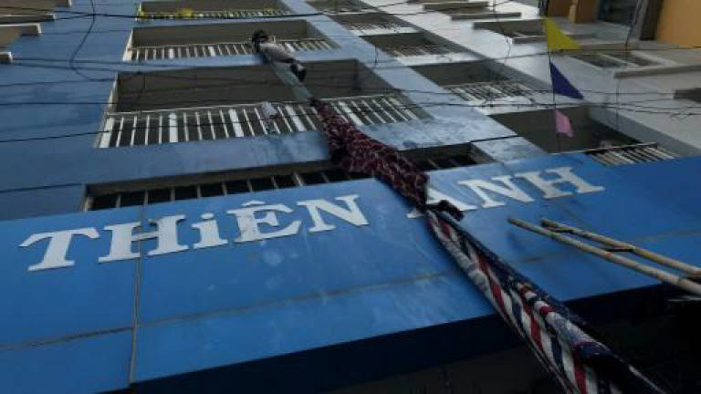 Thirteen dead in Vietnam highrise apartment fire