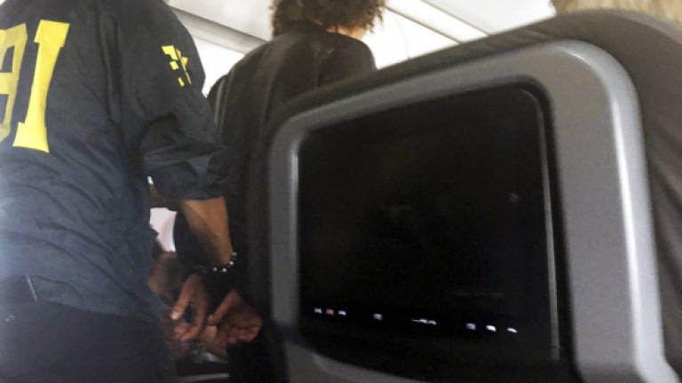 Unruly passenger aboard Hawaii flight prompted bomb scare: FBI
