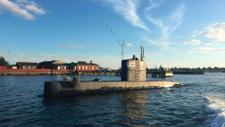 Danish submarine scanned for clues to journalist's death
