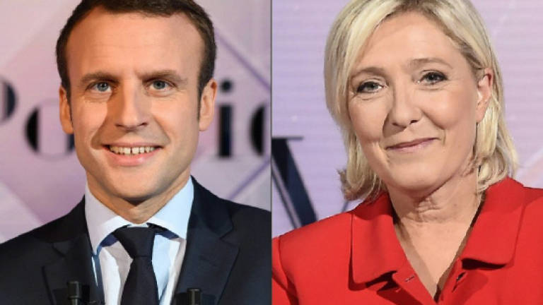 Le Pen, Macron face off in final French presidential debate