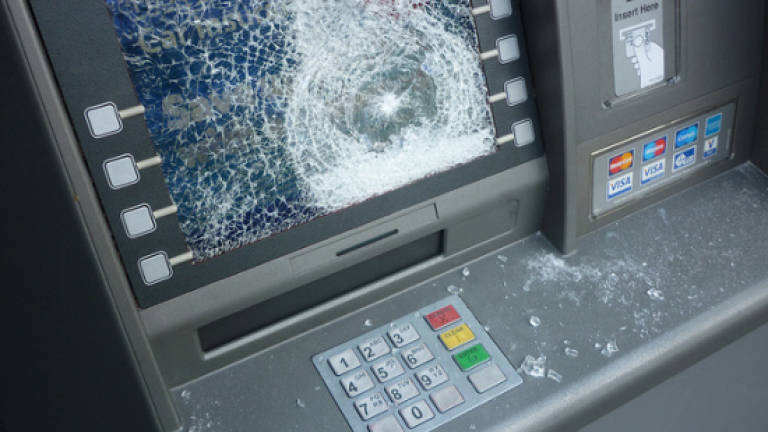 Police hunting ATM vandal