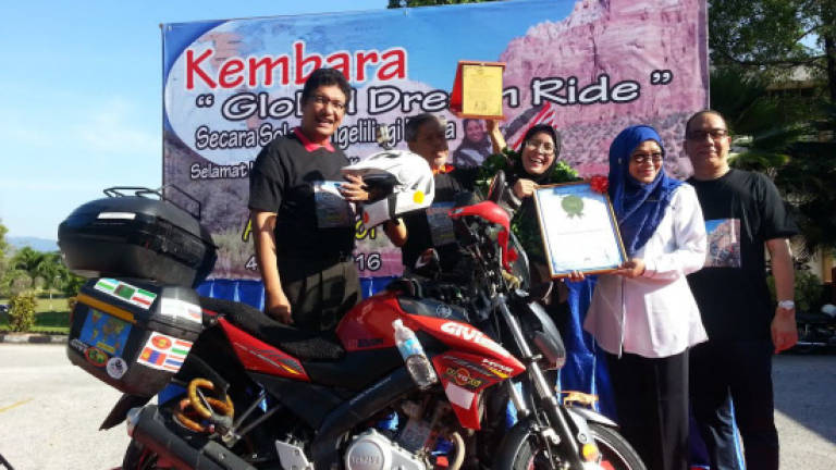 Malaysian woman becomes first solo Muslim to ride her bike around the globe