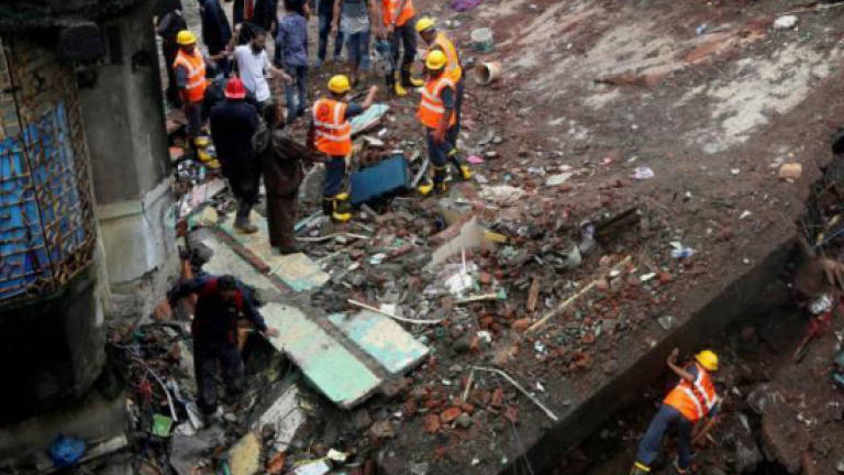 Family of six feared trapped in deadly India building collapse