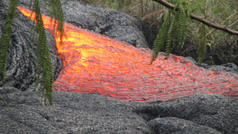 Hawaii lava flow burns through first home