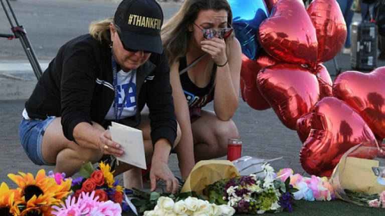 US mourns Vegas massacre victims as shooter motive sought