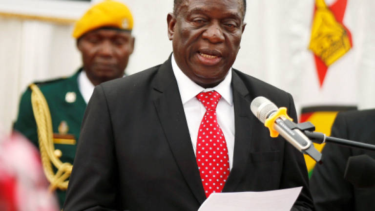 Zimbabwe's new president urges public unity as cabinet sworn in