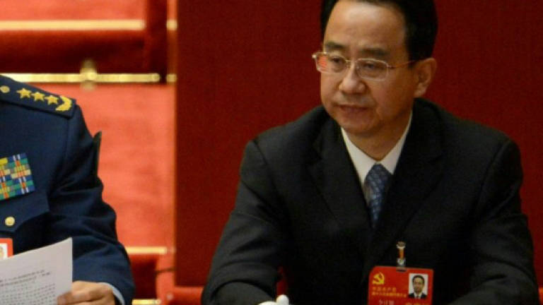 Former Chinese presidential top aide charged with bribery