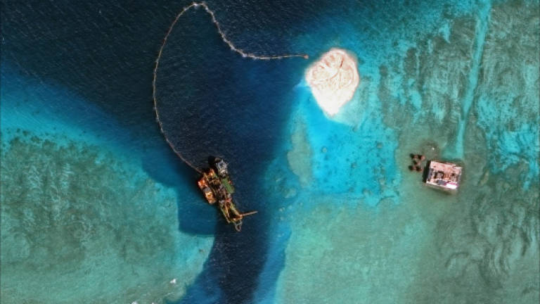 Philippines says Chinese reclamation damaged reefs
