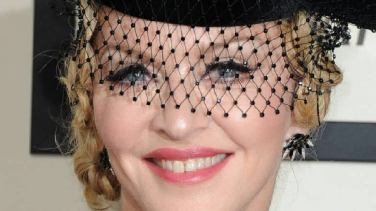 Madonna loses bid to stop auction of intimate items