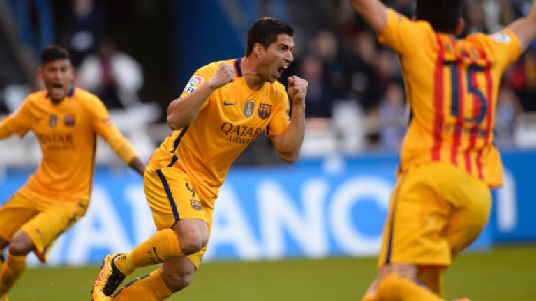 Three-way title race firmly in Barca's hands: Suarez