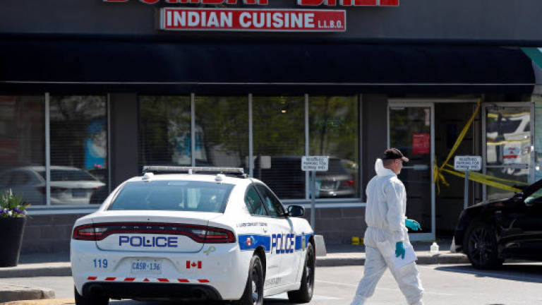 Canada hunts two suspects in restaurant blast that left 15 hurt