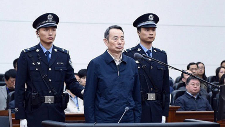 Top China official goes on trial for graft