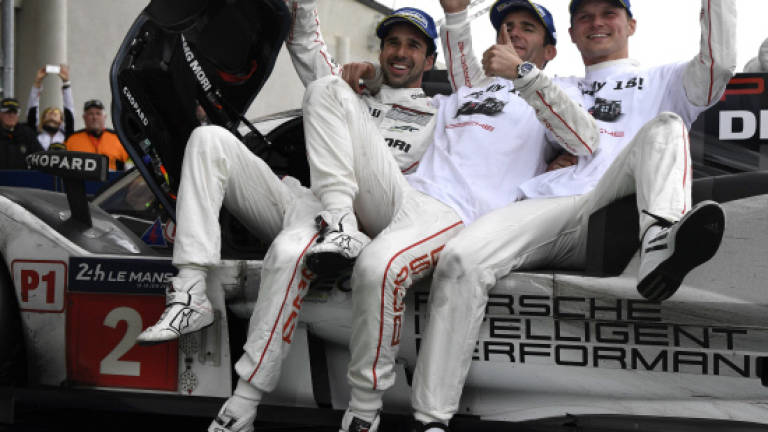 Motor racing: Porsche win dramatic Le Mans, Toyota heartache