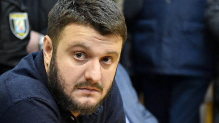 Ukraine court frees interior minister's son in graft case