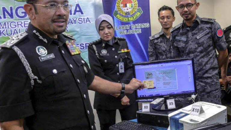 Three local men, two Indonesian women busted for falsifying identification documents