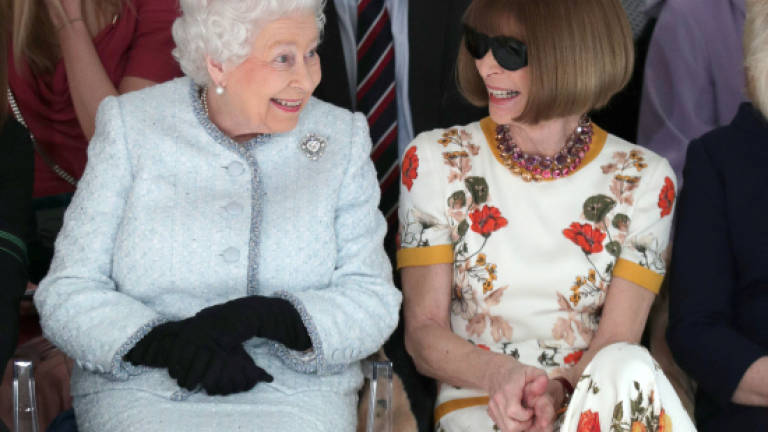 Britain's Queen makes surprise visit to London Fashion Week