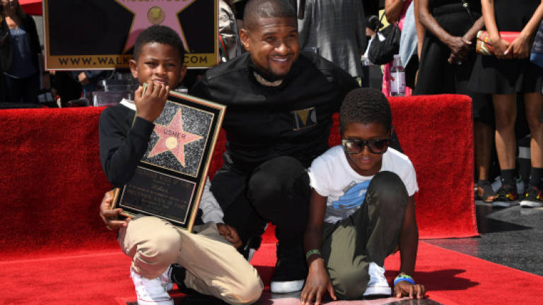 Usher calls on fans to keep his Walk of Fame star shiny