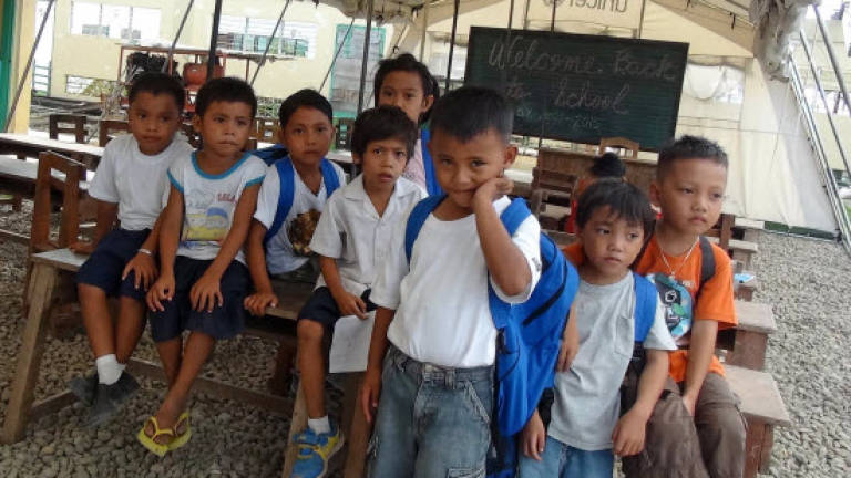 Students suffer in Philippine typhoon zone as schools open