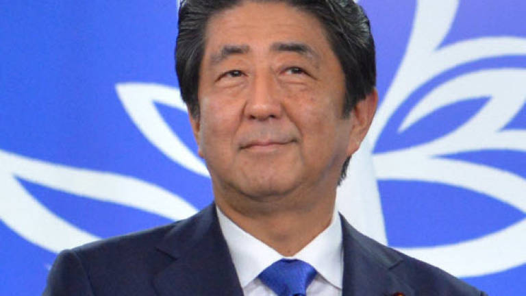 Abe calls for 'new epoch' in Russia-Japan ties hit by WWII dispute