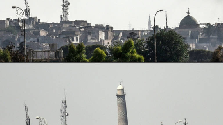 IS destroys iconic Mosul minaret as Iraqi forces advance