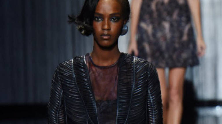 Armani revels in new freedom with catwalk charm offensive
