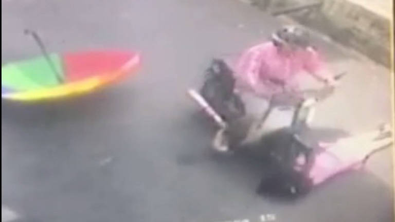 Viral video shows motorist crashing into, running over and robbing victim