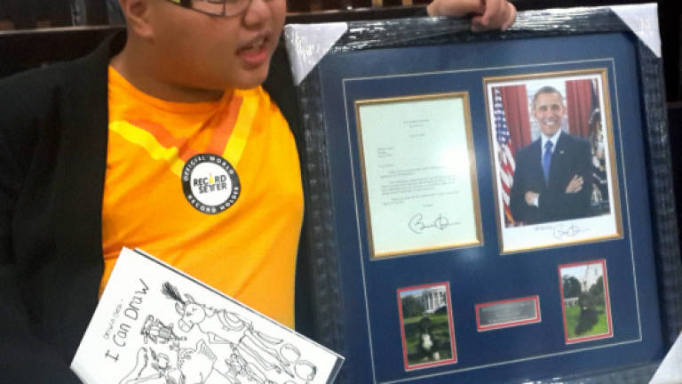 Nation's first autistic savant artist receives recognition from US president