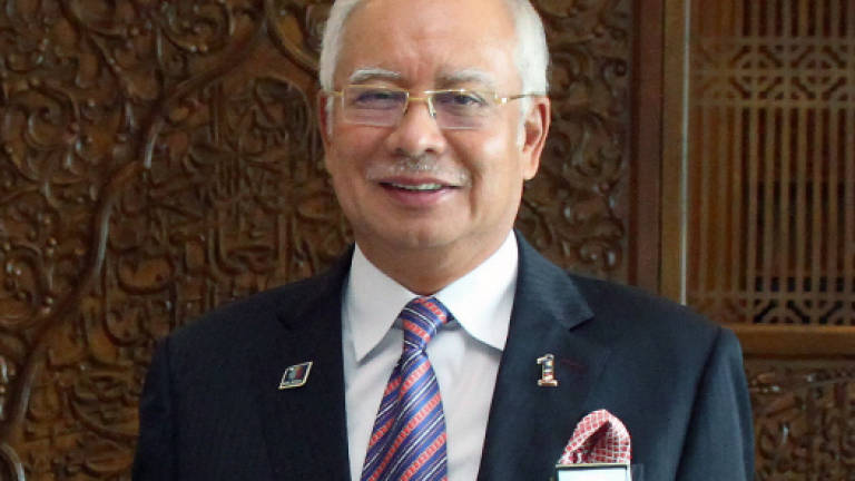 Najib congratulates modi over BJP state election victories