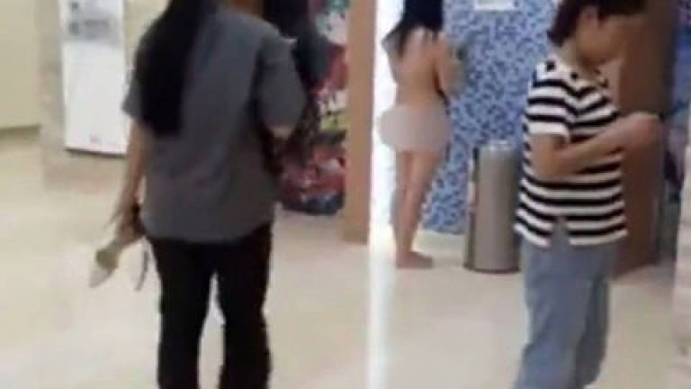 Woman strips naked after ex-hubby says he paid for her clothes