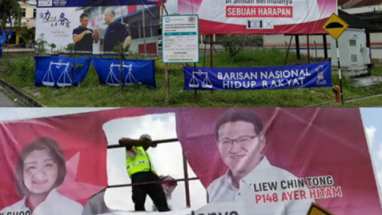 Not proper to cut out the face of Tun M from billboards: Hisham