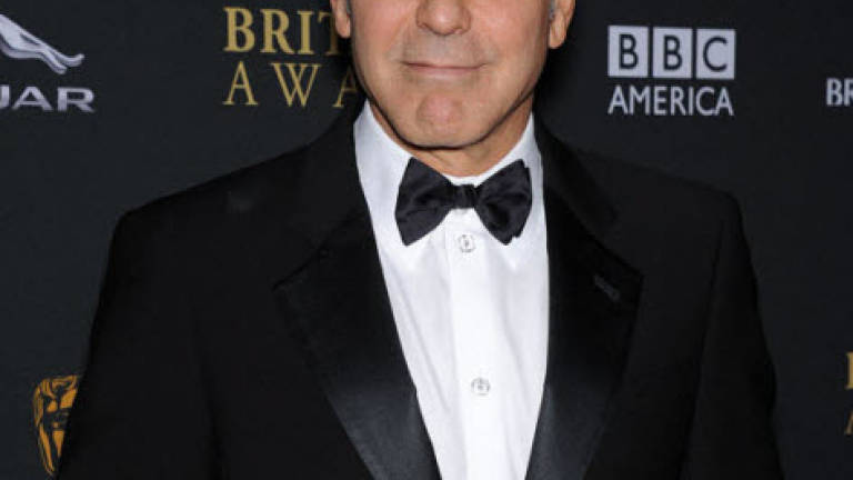 George Clooney to have 'red-blooded' bachelor party