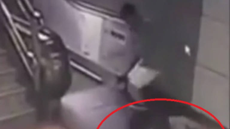 Commuter falls through hole in floor before escalator (Video)