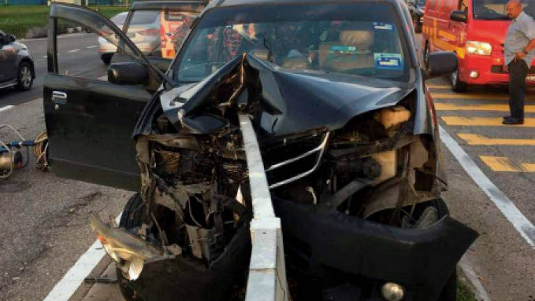 Man killed after car crashes into metal divider
