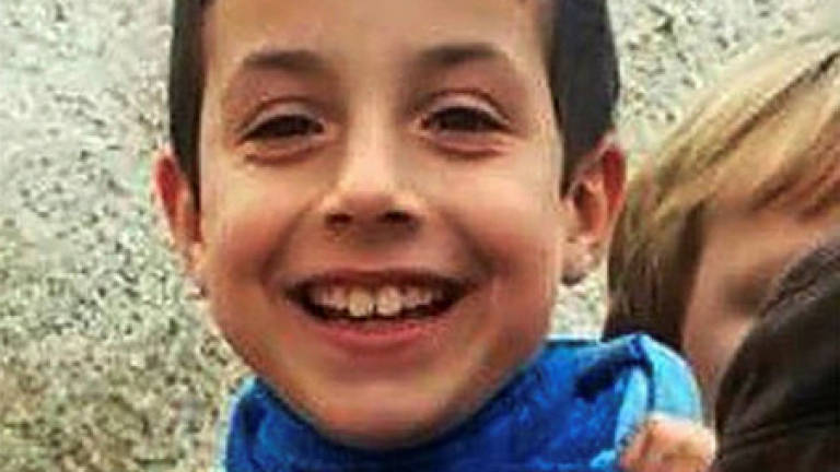 Hundreds of Spanish police, volunteers search for missing boy