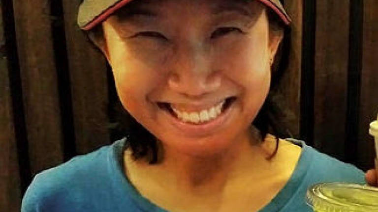 Family and friends prepare to bid farewell to marathon pacer Evelyn Ang