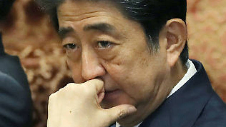Abe denies cronyism allegations