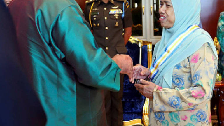 Johor Sultan confers DMIJ on a volunteer and state financial officer