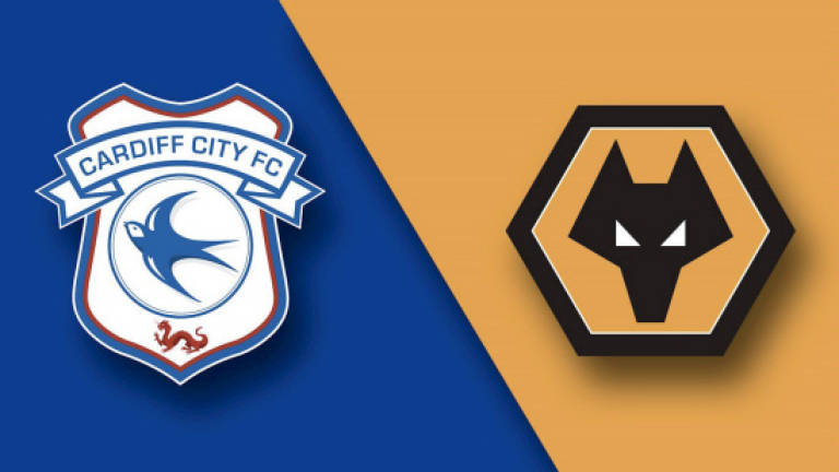 Wolves survive double penalty drama to beat Cardiff
